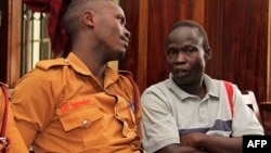 FILE - Suspected LRA (Lords Resistance Army) member Thomas Kwoyelo (R) is pictured during a pre-trial session at the High Court in Kampala on Februay 1, 2017. 