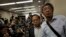 FILE - Freed Hong Kong bookseller Lam Wing-kee, right, is accompanied by pro-democracy lawyer Albert Ho after giving a news conference in Hong Kong, June 16, 2016. 