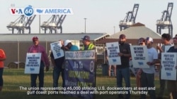 VOA60 America - US dockworkers to suspend strike until January