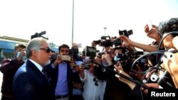 Abdullah Abdullah, chairman of the High Council for National Reconciliation, left, speaks to media before departing from Kabul, Afghanistan, to Doha, Qatar, Sept. 11, 2020.