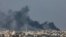 A picture taken from Rafah shows smoke billowing over Khan Yunis in the southern Gaza Strip following Israeli bombardment on December 15, 2023, amid continuing battles between Israel and the Palestinian militant group Hamas.