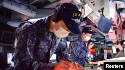 Japan, U.S. and South Korea hold a trilateral naval excercise in the Sea of Japan, also called East Sea in South Korea