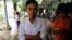 Poet Maung Saung Kha, 23, stands after a court sentenced him to six months in jail for defaming former president Thein Sein, making him one of the first political activists sentenced since Nobel Peace Prize laureate Aung San Suu Kyi took power in Yangon, 