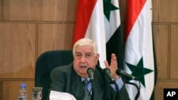 Menlu Suriah Walid Moallem dalan konferensi pers di Damaskus, Suriah, 6 April 2017. (SANA via AP)