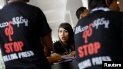 Journalists participate in a protest along the streets of Rangon after two weekly journals were banned indefinitely for publishing several stories without the consent of the local censorship board, Aug. 4, 2012.