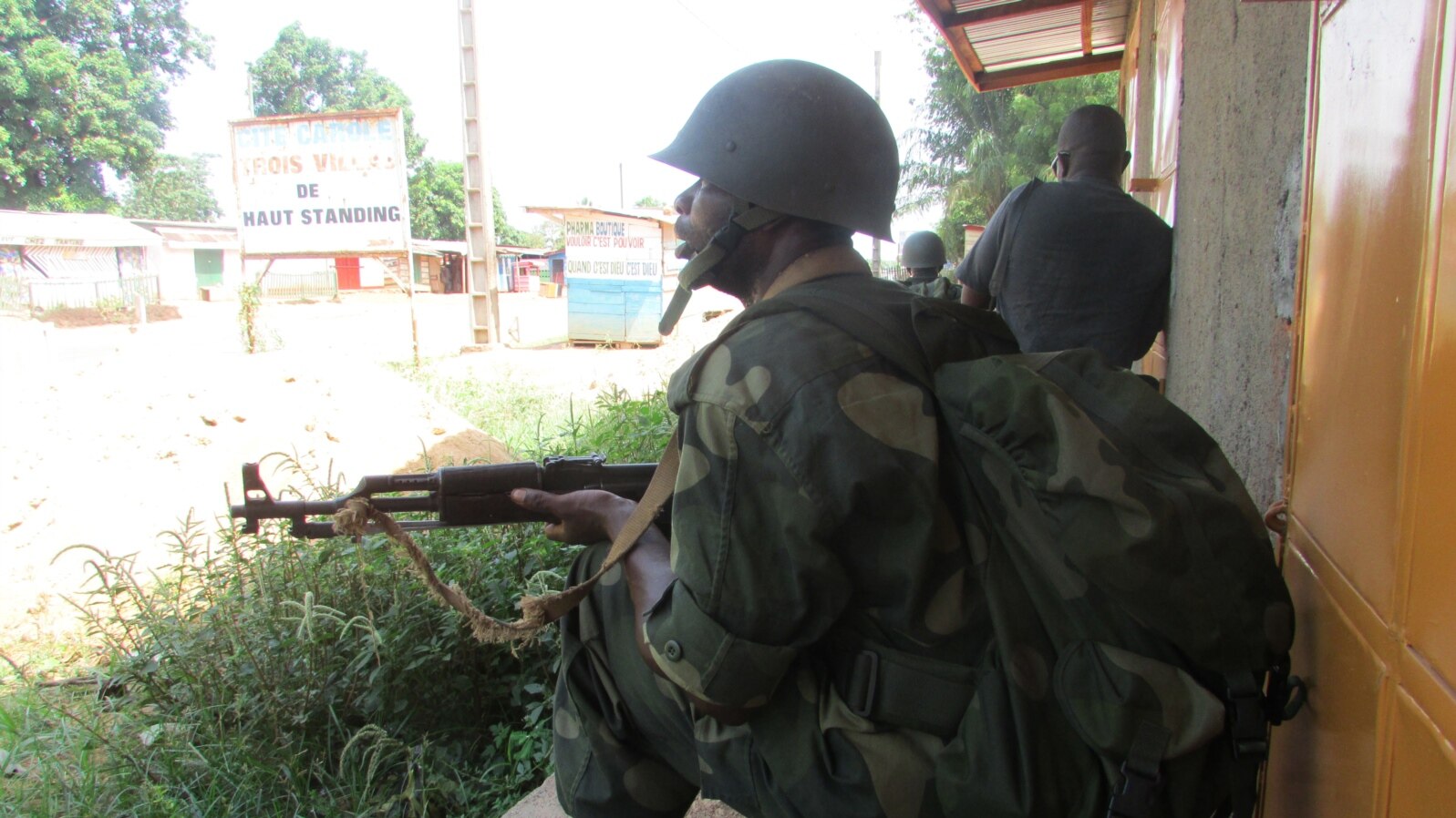 FILE - African Union intervention force secures the area during an operation to free the way leading to the north of Bangui, March 25, 2014. 