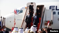 Israeli National Security Adviser Meir Ben-Shabbat and U.S. Treasury Secretary Steve Mnuchin disembark from Israeli flag carrier El Al's airliner upon their arrival in Muharraq, Bahrain, Oct. 18, 2020. 