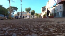 Volcanic ash from Mount Etna, which erupted during the night, covers a village road near Catania, Italy, Dec. 14, 2020 in this still image taken from video.