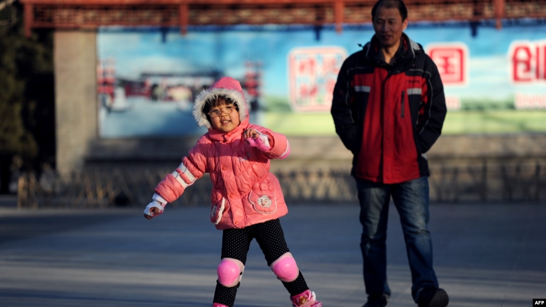 A girl roller-skates at a park in Beijing, Dec. 28, 2013. 