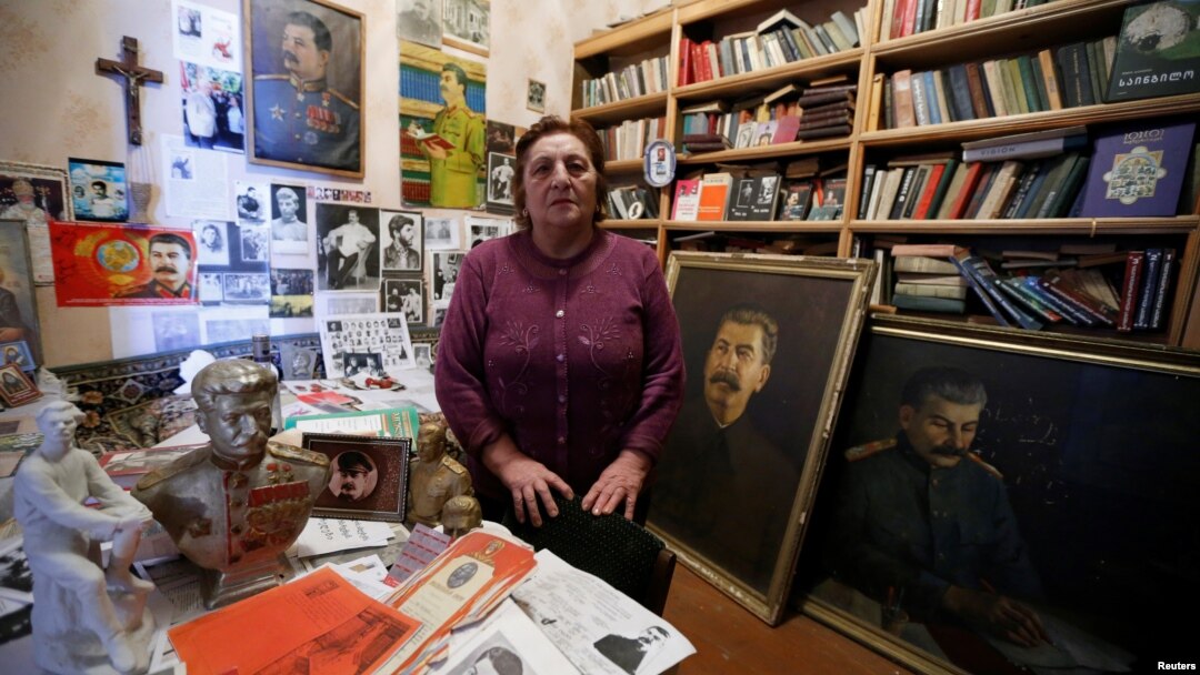 Nazi Stefanishvili, a 73-year-old retired economist, poses for a portrait in a room dedicated to Stalin at her home in Gori, Georgia, Dec. 6, 2016. 