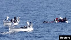 FILE - Migrants are rescued by the Italian Navy in the Mediterranean Sea, in this picture released on January 28, 2016 by Italian Navy.