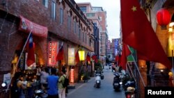 File--Chinese and Taiwanese flags are displayed around souvenir shops, in Kinmen, Taiwan August 19, 2018. 