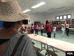 Baltimore City’s Liberty Village Project Manager Kim Trueheart looks on as her summer programs keep children active. Trueheart says “Charm City” needs jobs. (VOA/C. Presutti)