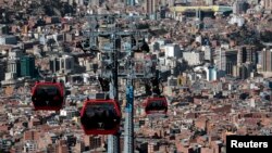 Cable cars travel over La Paz, Bolivia, July 23, 2015. Bolivia has the largest urban cable car system in the world.