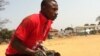 A young cricket player from the SLCA playing a match at the Kingtom oval in Freetown, Sierra Leone, January 12, 2013. (N. deVries/VOA)