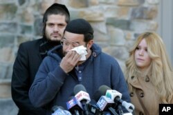 FILE - David Neumann, center, wipes his eyes as he speaks to reporters in New City, N.Y., Jan. 2, 2020, about his father, Josef Neumann, who was stabbed in an attack on a Hanukkah celebration.