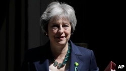 Britain's Prime Minister Theresa May leaves 10 Downing Street, June 13, 2018. May won a vote in Parliament Wednesday over how much control lawmakers should have over the country's departure from the European Union. 