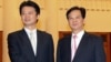 Japanese Foreign Minister Koichiro Gemba (L) shakes hands with Vietnamese Prime Minister Nguyen Tan Dung during their meeting at the Government Office in Hanoi, Vietnam, July 14, 2012. (AP)