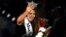 FILE - Miss North Dakota Cara Mund reacts after being announced as the winner of the 97th Miss America Competition in Atlantic City, New Jersey, Sept. 10, 2017.
