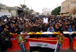 Supporters of Iraqi Shiite cleric Muqtada al-Sadr gather near his home, after it was attacked, in the holy city of Najaf, Iraq, Dec. 7, 2019.