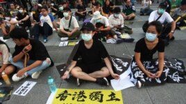 Hong Kong protesters in Taiwan and Taiwanese supporters gathered to mark the first anniversary of a mass rally in Hong Kong against its now-withdrawn extradition bil at Democracy Square in in Taipei, Taiwan, Saturday, June 13, 2020. (AP Photo/Chiang)