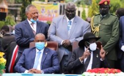 Sudan's Sovereign Council Chief Gen. Abdel Fattah al-Burhan and South Sudan's President Salva Kiir attend the signing of a peace accord between Sudan's transitional government and Sudanese revolutionary movements, in Juba, South Sudan Oct. 3, 2020.