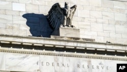 FILE - A detail of the Federal Reserve building is seen in Washington, Nov. 16, 2020.