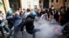FILE - Restaurant owners clash with police as tensions rise over COVID-19 restrictions on businesses, in Rome, Italy, April 6, 2021. 
