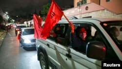 Supporters of Xiomara Castro, presidential candidate of the Liberty and Refoundation Party, take part in a caravan at their headquarters in Tegucigalpa, Honduras, Nov. 29, 2021.