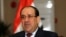 Iraq's Prime Minister Nuri al-Maliki speaks during an interview with Reuters in Baghdad, Jan. 12, 2014. 