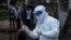 ရန်ကုန်မြို့ရှိ Quarantine စင်တာတခုမှာ ကိုဗစ်ရောဂါပိုး ရှိ၊မရှိ စစ်ဆေးပေးနေတဲ့ မြင်ကွင်း။ (အောက်တိုဘာ ၀၈၊ ၂၀၂၀)