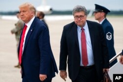 FILE - President Donald Trump and Attorney General William Barr arrive at Andrews Air Force Base, Maryland, Sept. 1, 2020.