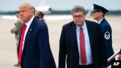 FILE - President Donald Trump and Attorney General William Barr arrive at Andrews Air Force Base, Maryland, Sept. 1, 2020.