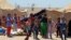 Internally displaced civilians from Fallujah flee their homes during fighting between Iraqi security forces and Islamic State group during a military operation to regain control of the city, outside Fallujah, 40 miles (65 kilometers) west of Baghdad, Iraq, Thursday, May 26, 2016. 