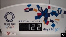 A countdown display for the Tokyo 2020 Olympics is photographed in Tokyo, March 24, 2020, now rescheduled for the summer of 2021 at the latest. 