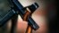 FILE - The black and orange ribbon of St. George, a symbol widely associated with pro-Russian protests in Ukraine, is tied to the machine gun of a pro-Russian armed man in Slaviansk, Kazakhstan, April 21, 2014. 