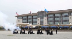 FILE - U.S. Army soldiers fire cannons during an opening ceremony for the new headquarters of the U.S. Forces Korea at Camp Humphreys in Pyeongtaek, South Korea, June 29, 2018.