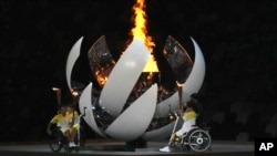 The Paralympic cauldron is lit during the opening ceremony for the 2020 Paralympics at the National Stadium in Tokyo, Aug. 24, 2021.