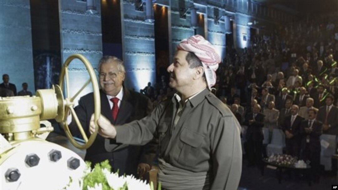 KRG president Massud Barzani, right, and Iraqi President Jalal Talabani open a ceremonial valve during an event to celebrate the start of oil exports from the autonomous region of Kurdistan, Irbil, Iraq, June 1, 2009.