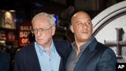 Sir Michael Caine and Vin Diesel pose for photographers upon arrival at the premiere of "The Last Witch Hunter" in London, Oct. 19, 2015.