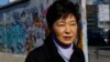 South Korean President Park Geun-hye looks at the exhibition 'DMZ-Gruenes Band' during a visit to the East Side Gallery in Berlin, March 27, 2014. 