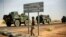 French armored vehicles are seen heading towards the Niger border before making a left turn north in Gao, northern Mali, Feb. 6, 2013