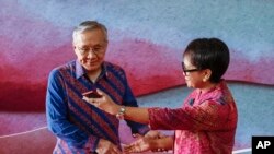 Indonesian Foreign Minister Retno Marsudi, right, greets Thailand's Foreign Minister Don Pramudwinai during the Association of Southeast Asian Nations (ASEAN) Foreign Ministers' Meeting ahead of the 42nd ASEAN Summit in Indonesia, Tuesday, May 9, 2023.