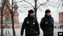 FILE - Police officers patrol Red Square in Moscow, Russia, March 22, 2016.