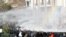 Turkish riot police use water cannon to disperse demonstrators protesting outside the Supreme Electoral Council (YSK) in Ankara against local election results which the Islamic-rooted party of Premier Recep Tayyip Erdogan claimed sweeping victories.