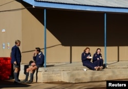 FILE—Students look on during their lunch break at the Orania CVO School, in Orania, in the Northern Cape province of South Africa, May 28, 2024.