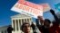 FILE - Abortion rights activists protest outside of the U.S. Supreme Court, during the March for Life in Washington, Jan. 18, 2019. 