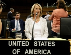 U.S. Ambassador Jackie Wolcott waits for the start of the International Atomic Energy Agency, IAEA, board of governors meeting at the International Center in Vienna, July 10, 2019.