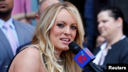 FILE - Stormy Daniels, the porn star currently in legal battles with U.S. President Donald Trump, speaks during a ceremony in her honor in West Hollywood, California, May 23, 2018.