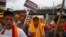 FILE - Activists of All Assam Students' Union (AASU), along with 28 other organizations walk during a protest rally against India’s Citizenship Amendment Bill 2016 in Gauhati, northeastern Assam state, India, June 29, 2018.